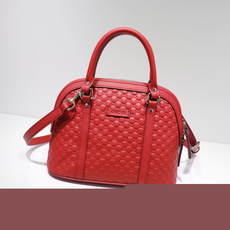 G*u*i top handle bags